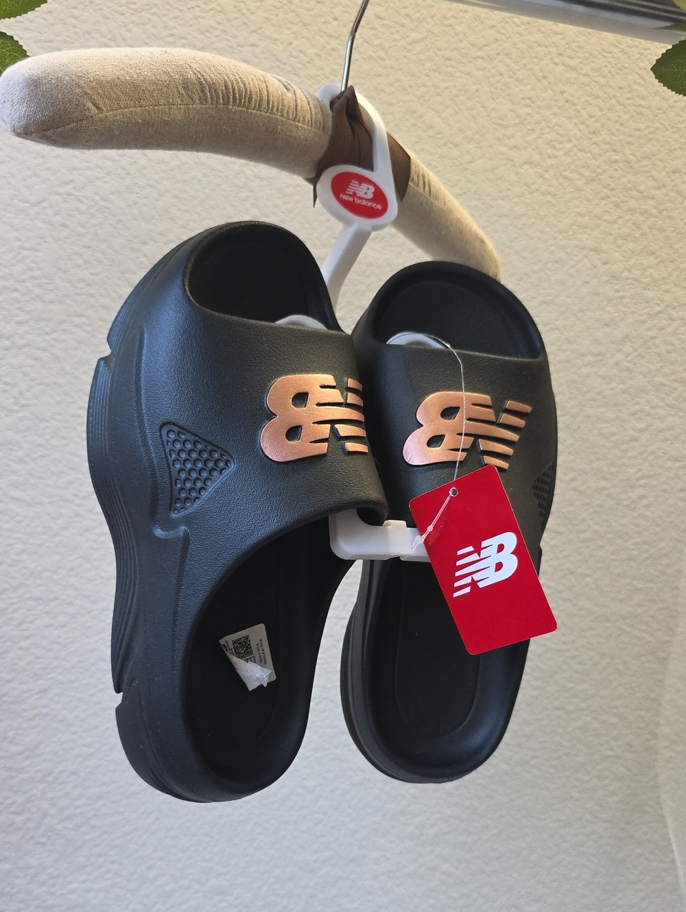 New Balance Black Slides with Rose Metallic Logo
